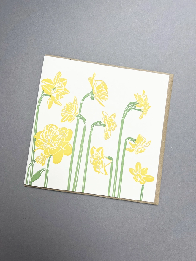 the front of the card showing 10 stems of different varieties of daffodils all together letterpress printed by lovely people in the UK