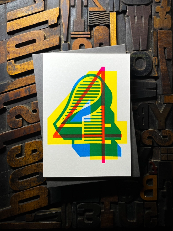 4th birthday anniversary milestone typographic letterpress card with deep impression print. Very colourful and vibrant. They show slight colour variations adding to the style anding to the charm of this handmade greeting card.