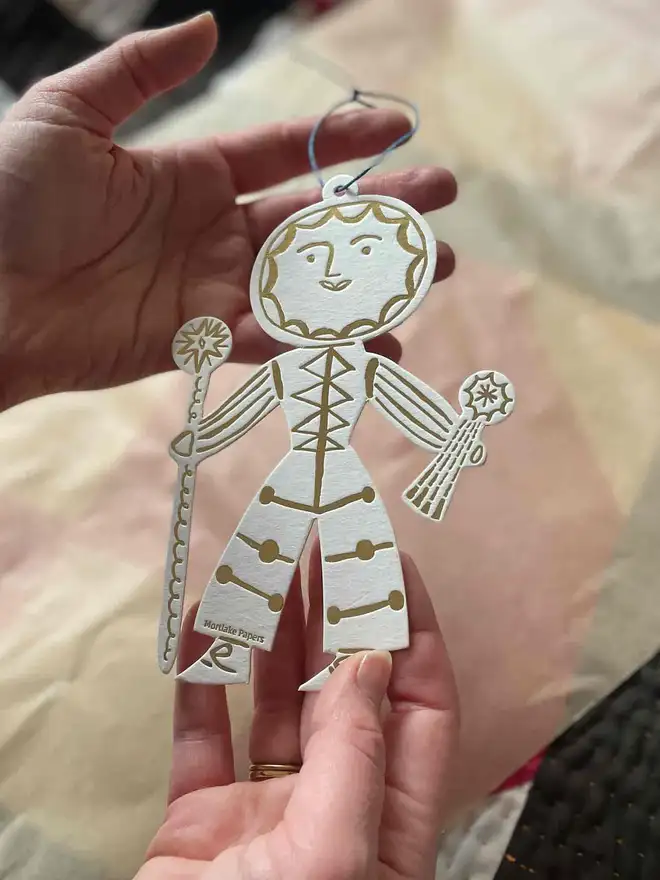 sun solstice gold and cream christmas ornament