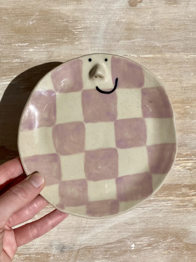 violet ceramic side plate - held