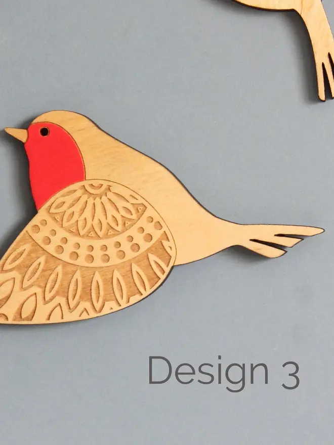 Folk Art Wooden Wall Robins (Set Of 3), a wooden robin hung up flying on a wall