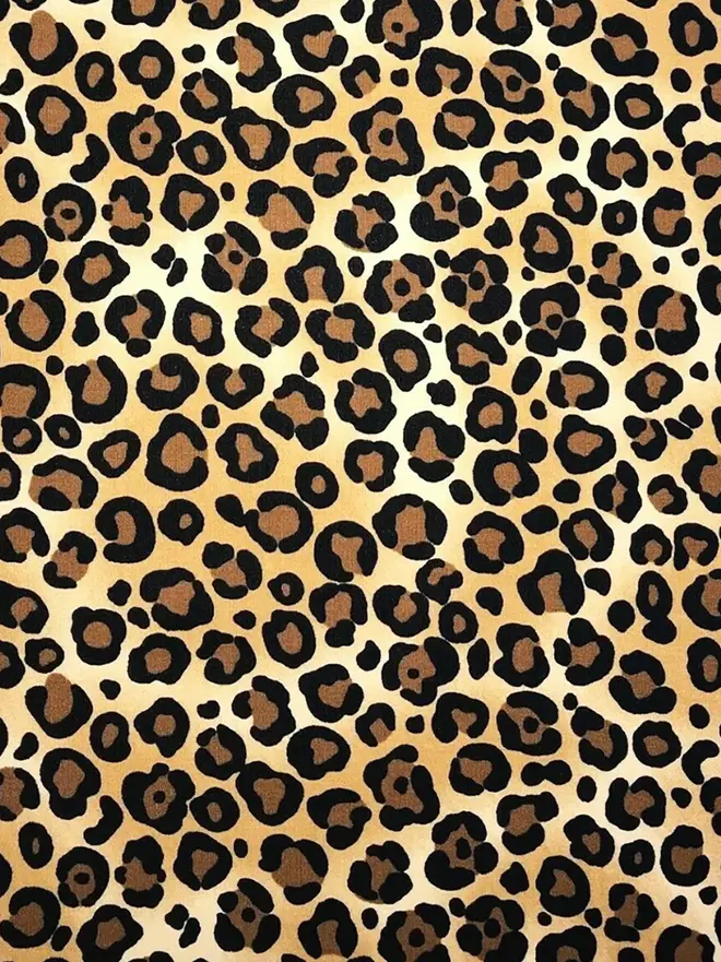 Wild Leopard print cotton fabric - close up. 