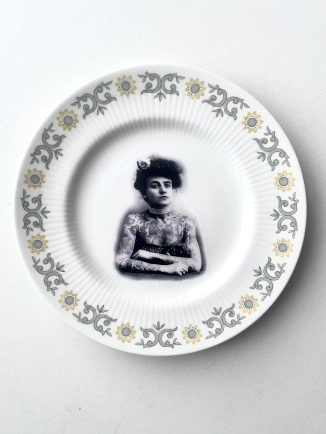 I found a vintage fine bone china plate, and sourced a vintage Tattooed Victorian Woman image in the centre