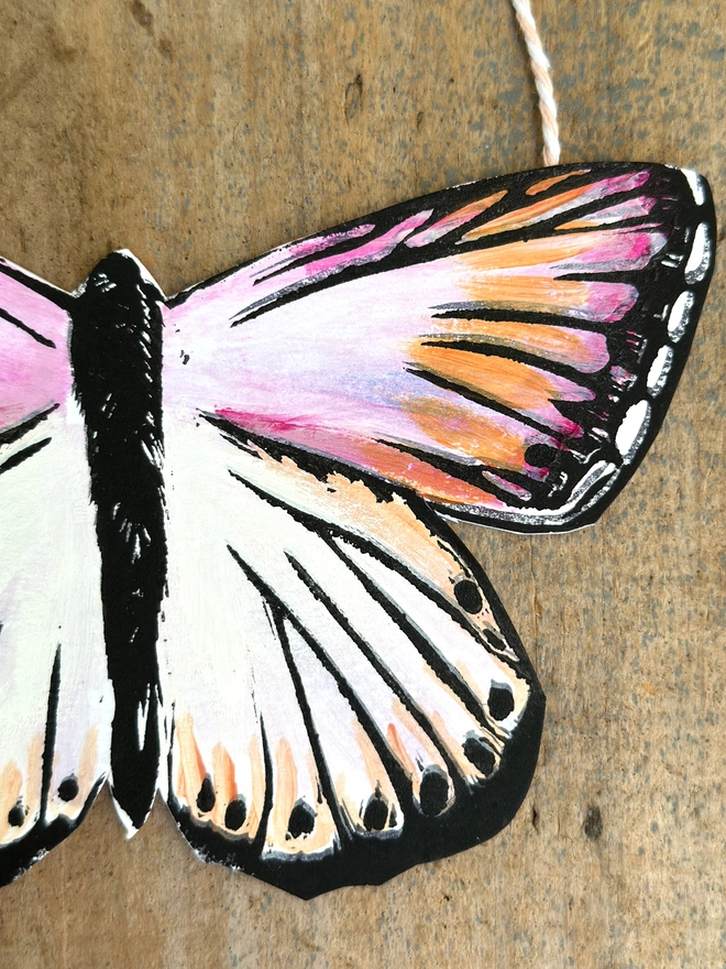 3 Hand Painted Butterflies. Set Of Linocut Wall Hangings. Close up of wing, pink, orange and cream butterfly 