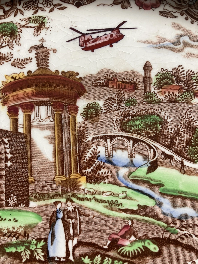 Brown toned vintage plate by W.R Midwinter featuring a classic countryside scene and the addition of a Chinook helicopter in the sky