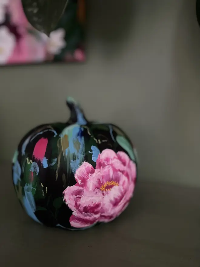 hand painted ceramic floral halloween pumpkin black background vibrant pink peony flowers