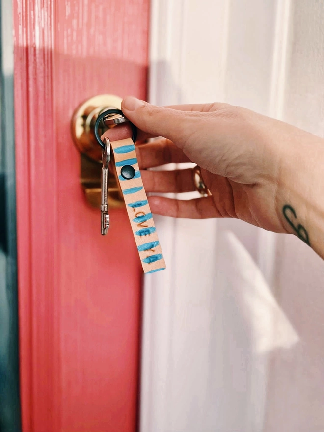 Hand painted key ring in door image 