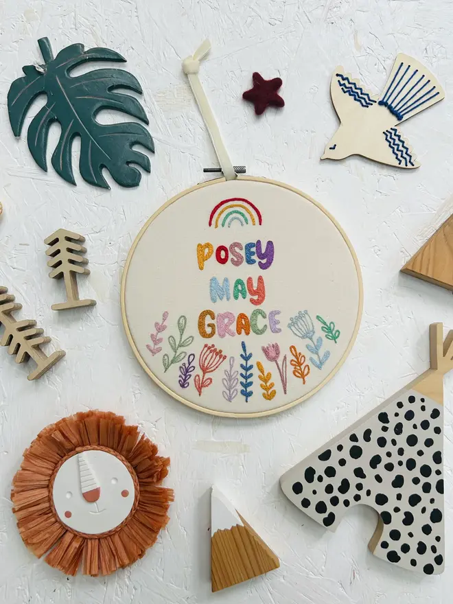 custom embroidered hoop. cotton hoop embroidered with multi coloured lettering.