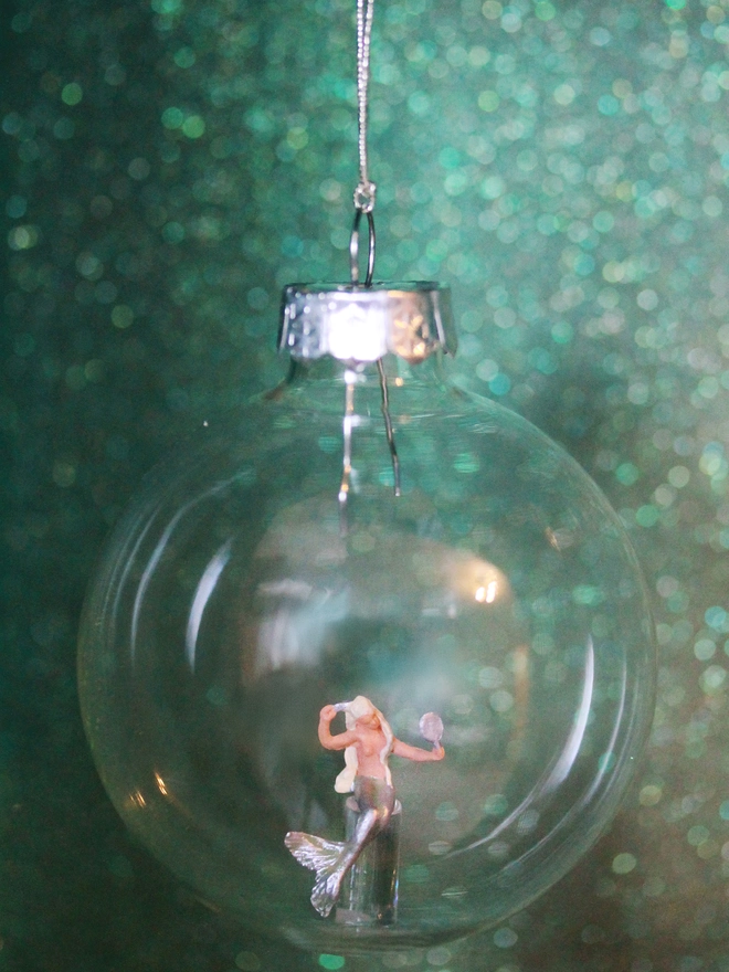 Miniature figure of a Mermaid in a glass Christmas bauble  
