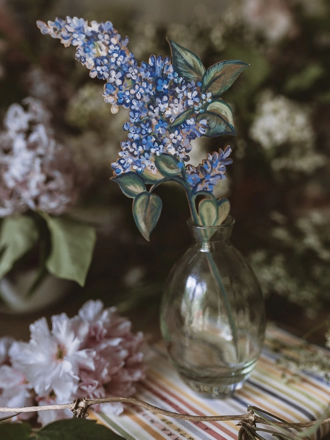 Wooden Lilac Stem in a vase, set amongst some fresh flowers