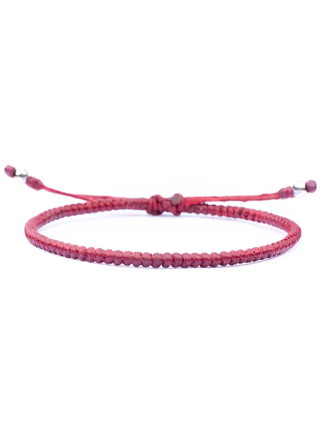 red string bracelet