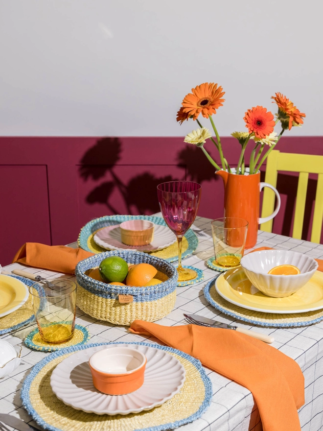 table setting laid using blue and yellow tableware
