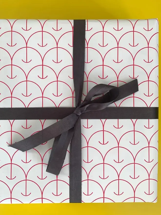 Apple Pattern Wrapping Paper, against a yellow background. 