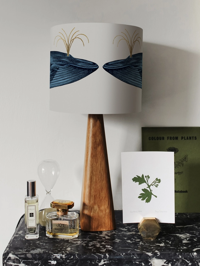 Handmade blue whale lampshade with gold details featuring vintage inspired ocean artwork
