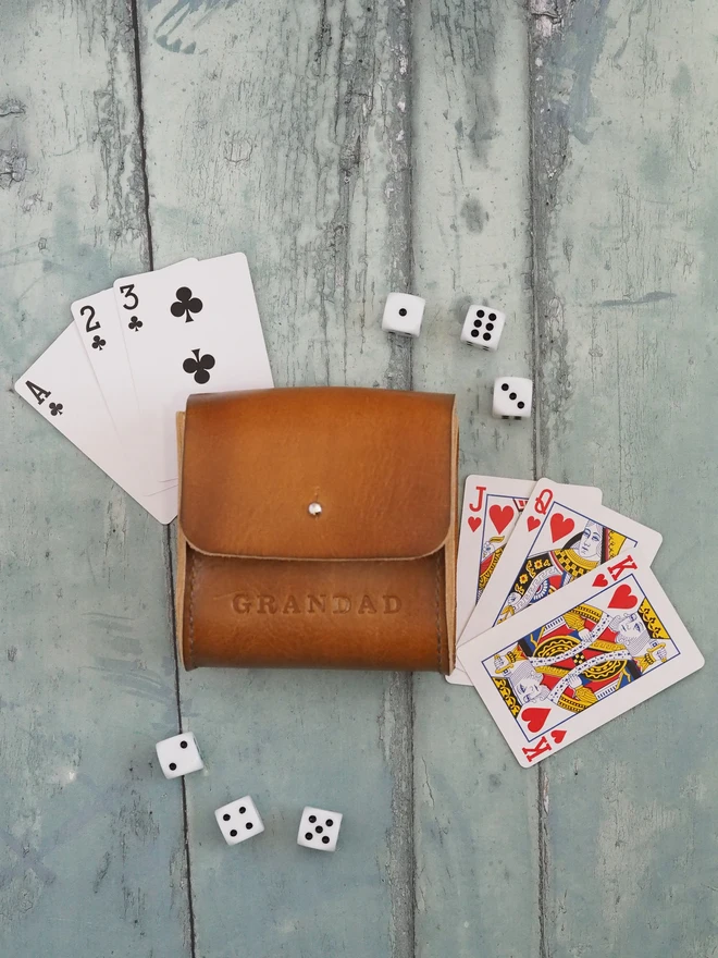 Personalised Leather Playing card and dice carry case. A hand dyed tan brown leather pouch holding two decks of cards and 6 dice. Personalised with the name GRANDAD.