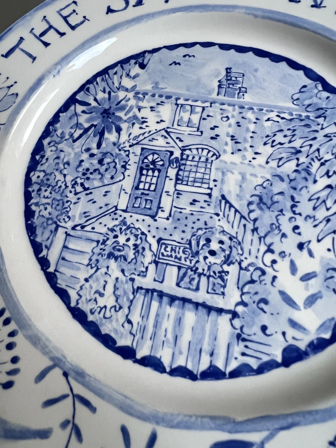 detail of middle of plate in close up, two dogs at a gate