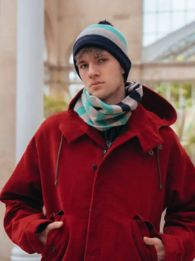 Jade, navy snood being worn on male model