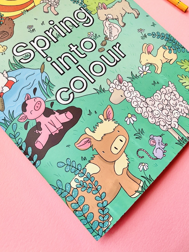Baby animals hand drawn colouring book reads ‘Spring into colour’ on a farm scene with baby animals with cows, pigs, rabbits, alpaca and goats.