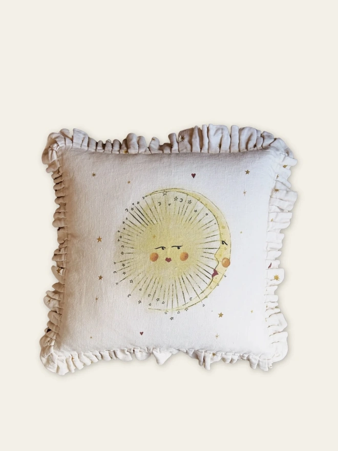 'Astral Weeks' Linen Ruffled Cushion Cover, a white and yellow cushion with a sun motif. 