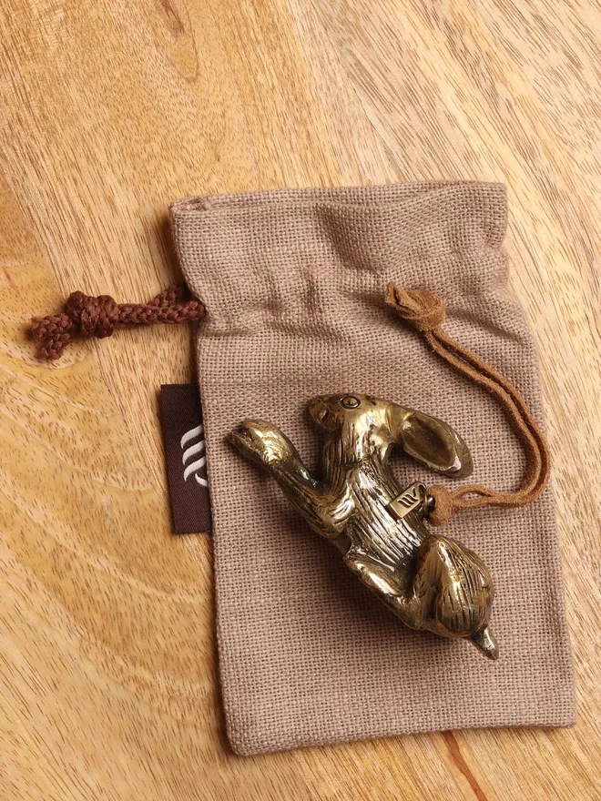 Metal hare christmas ornament on gift bag