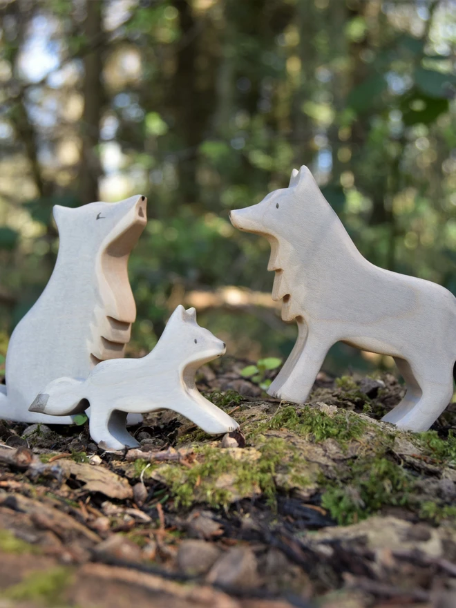 wooden wolf family toy collection made by eric and albert