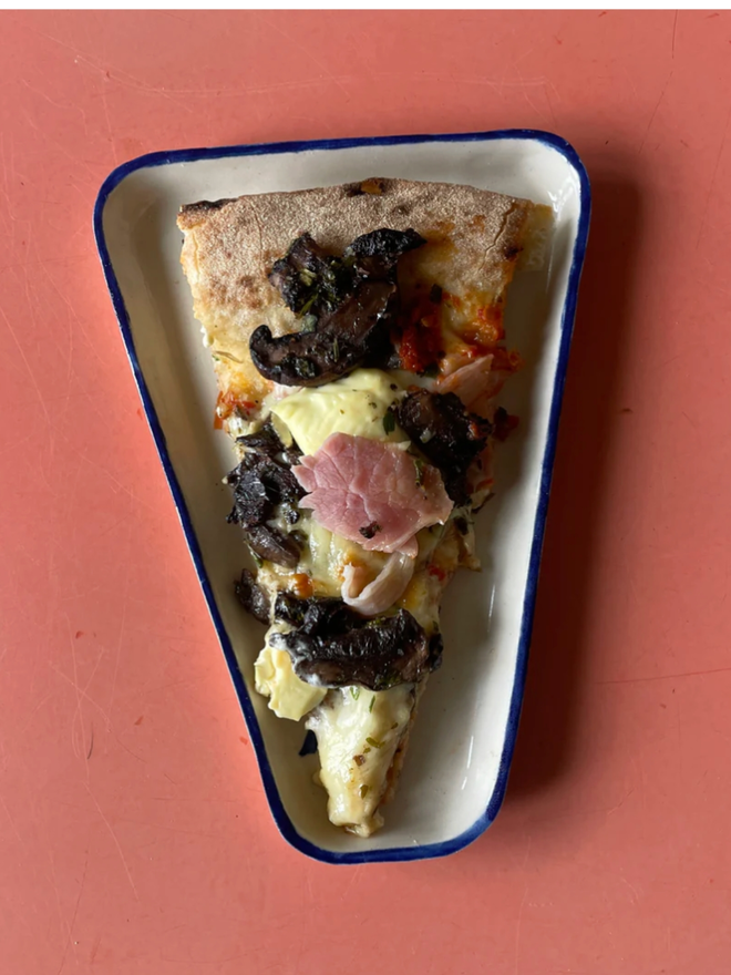 24/7 Dish. A triangular dish with 24/7 printed on.