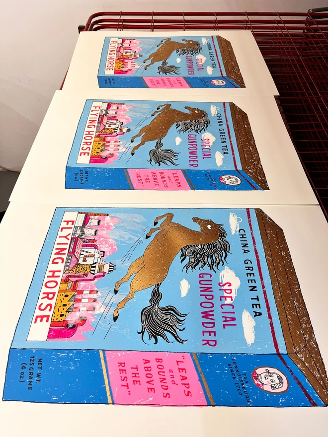 Flying Horse Screenprint 'One Giant Leap', a group of colourful green tea designs in the centre of  white screenprint. 
