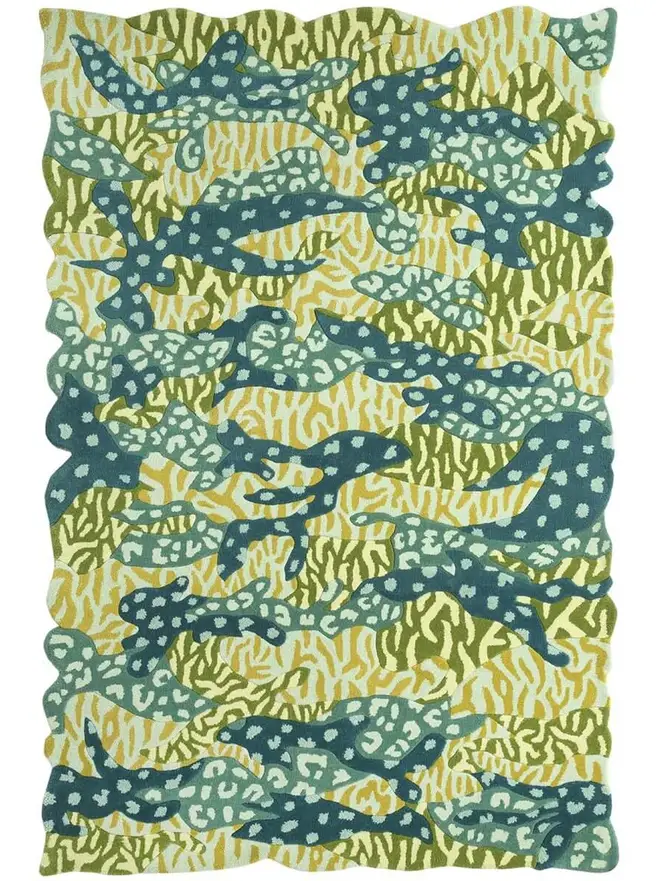 Big Cat Camo Hand Tufted Rug, a colourful rug sitting on a plain surface. 