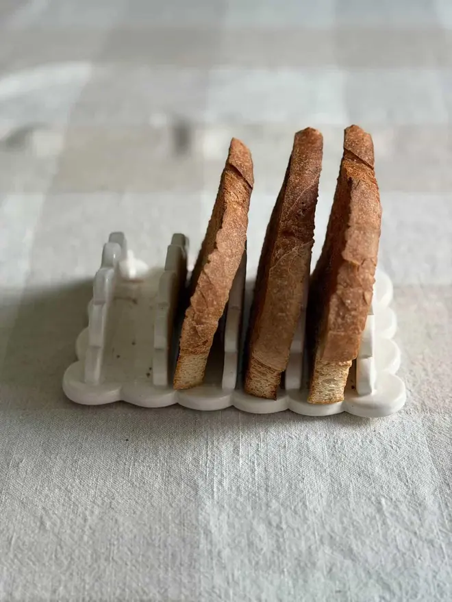 White scalloped stoneware toast rack