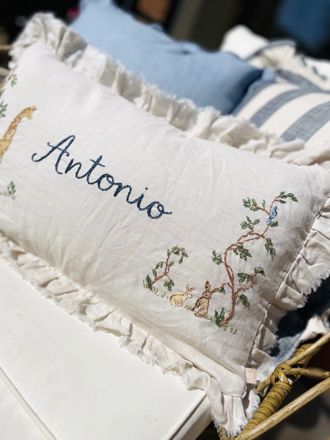 Soft Linen personalised cushion with giraffe and bunny motif - blossom and bramble embroidery