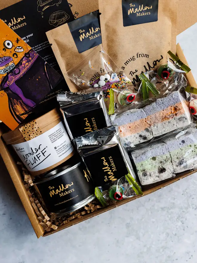 The Mallow Makers looking down into the contents of Halloween Monster S'mores Kit