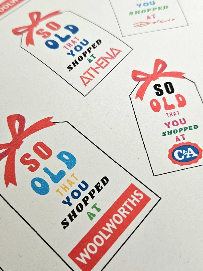 Wrapping paper design with tags and text is written in bright  multi colours .