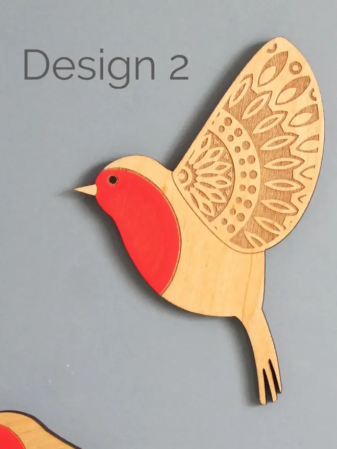 Folk Art Wooden Wall Robins (Set Of 3), a wooden robin hung up flying on a wall. 