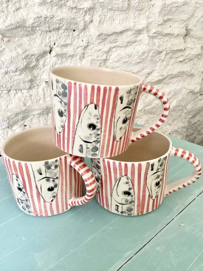 Handmade red stripy fish mug stack