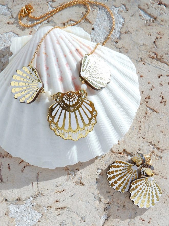 white leather seashell necklace, on a shell