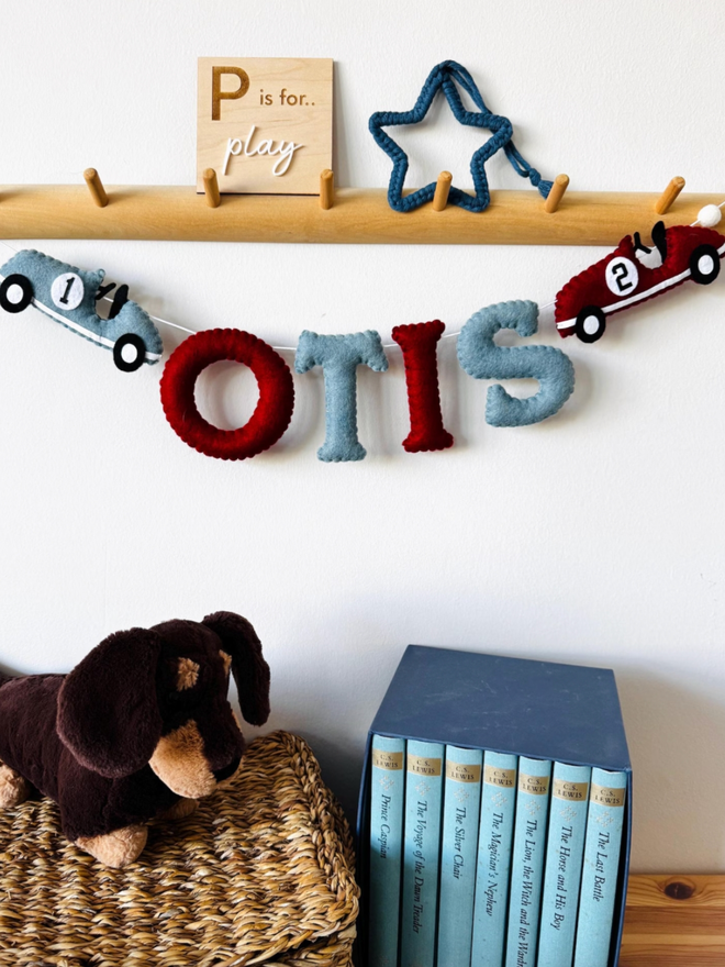 Personalised Race Car Garland. A garland in red and grey with a race car theme.