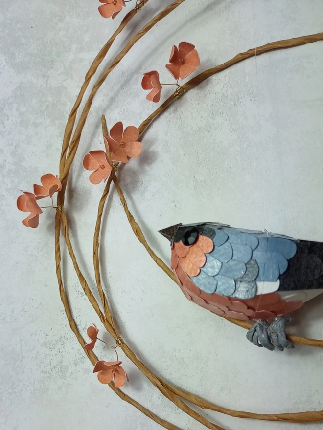 Close up of a bullfinch bird sculpture