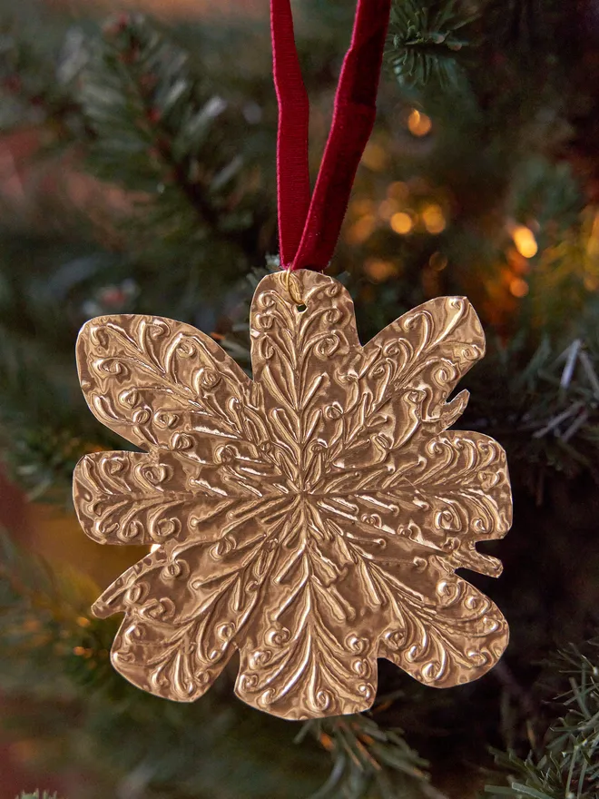 Snowflake embossed tin decoration