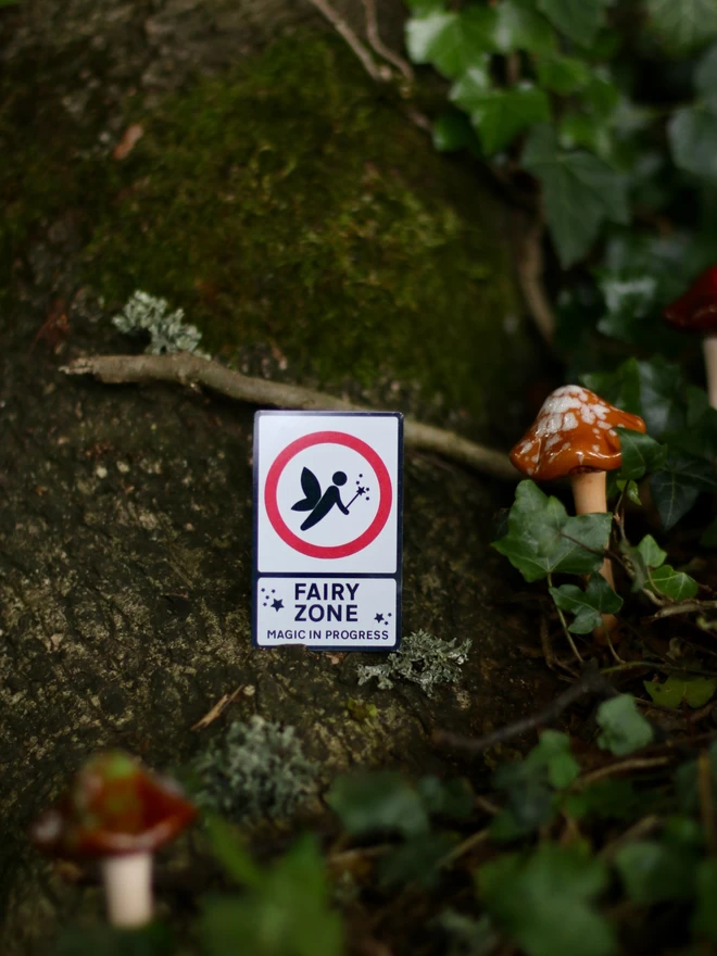 metal road sign style fairy sign by a magic mushroom 