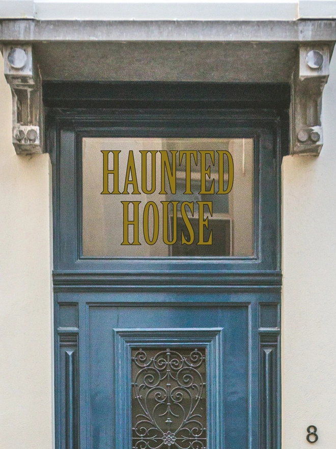 haunted house wall sticker above a front door