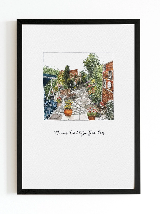 A black frame with white page inside and the illustration in the centre is a crazy paved garden with brick wall and planted border to the right, swing seat, pond, shed and pots to the left. Black calligraphy hand lettering below reads 'Nan's Cottage Garden'