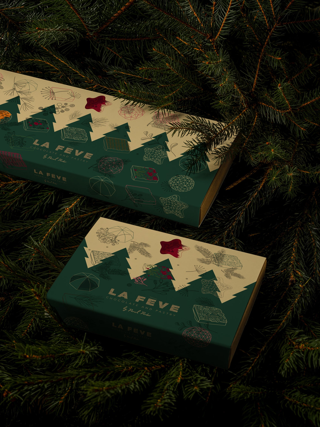 Christmas chocolate box closed, showing festive graphic design on eco lux paper package
