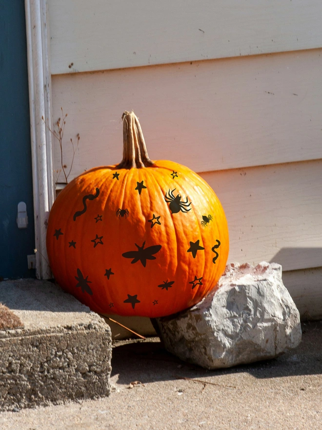 Pumpkin decorated with Joanie & Jeanie peel-and-stick Halloween stickers