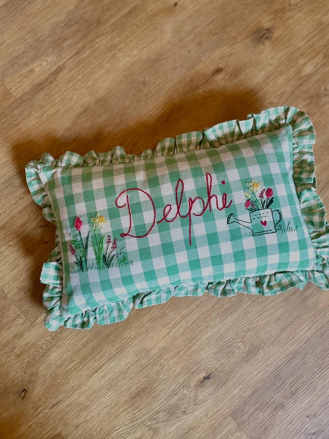 Hand embroidered green cushion gingham floral watering can design 