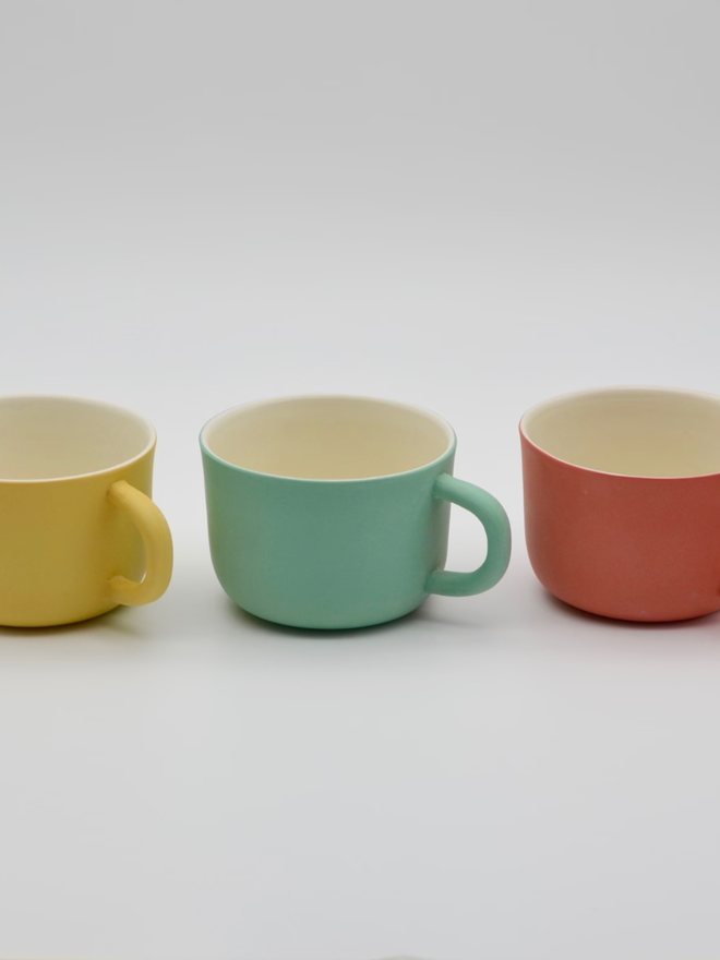 Handmade Porcelain Coffee Cup. Three coffee cups in a row.