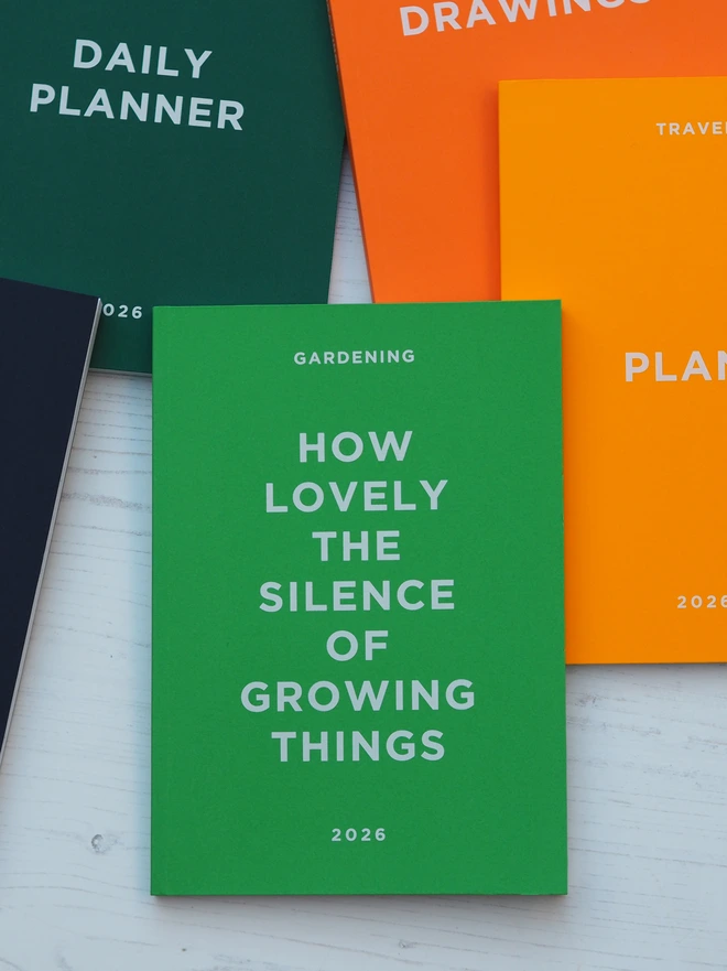 personalised gardening notebook with the quote how lovely the silence of growing things