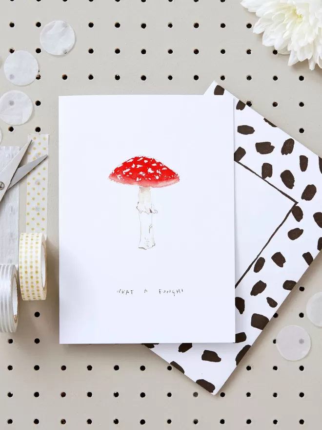 Liz Temperley 'what a funghi' mushrrom card seen with a spotted envelope behind.