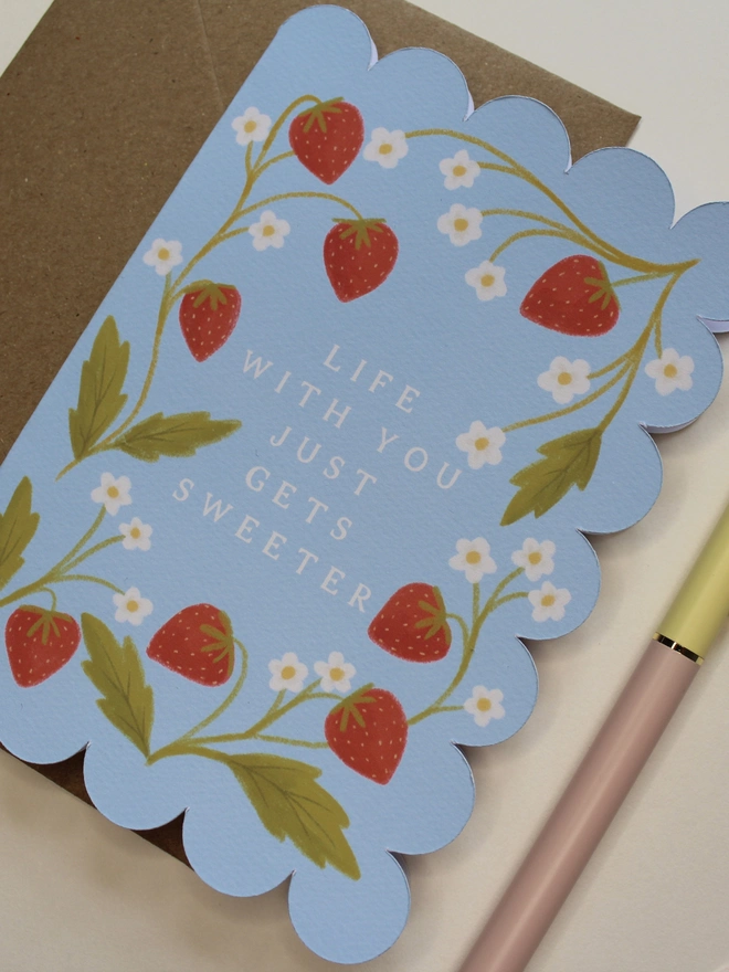illustrated strawberry anniversary card with scalloped edge