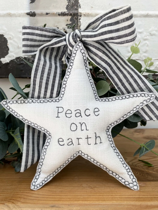 Large Fabric Tree Topper Star on a shelf