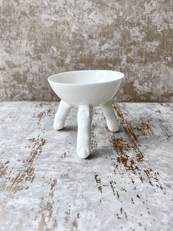 Small porcelain bowl with fingers. Halloween decor.